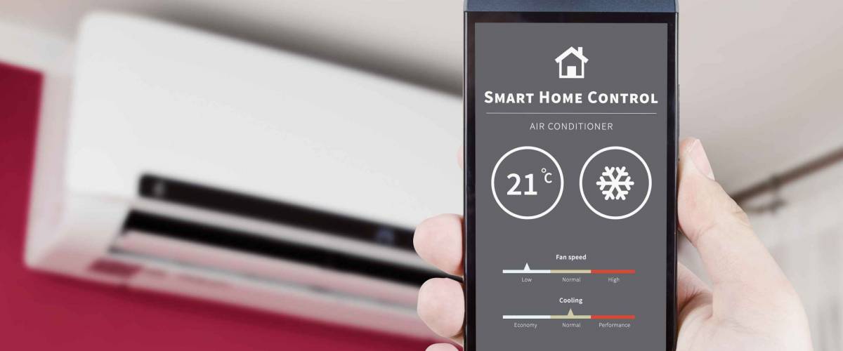 Air conditioner remote control with smart home system on digital device.