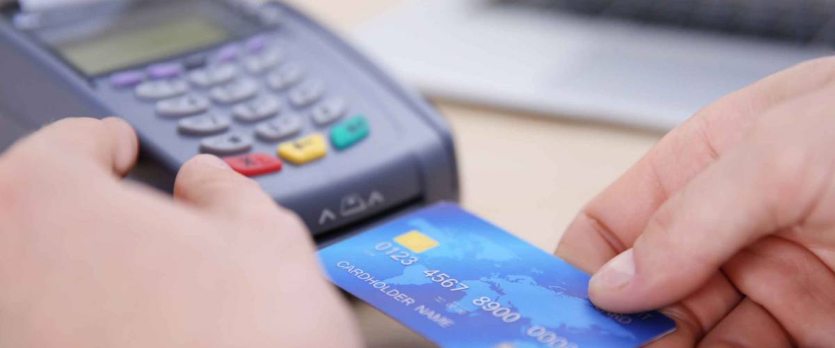 Businessman using payment terminal