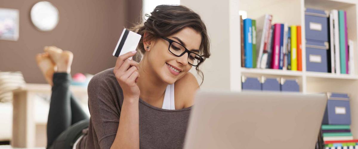 Happy woman doing online shopping at home