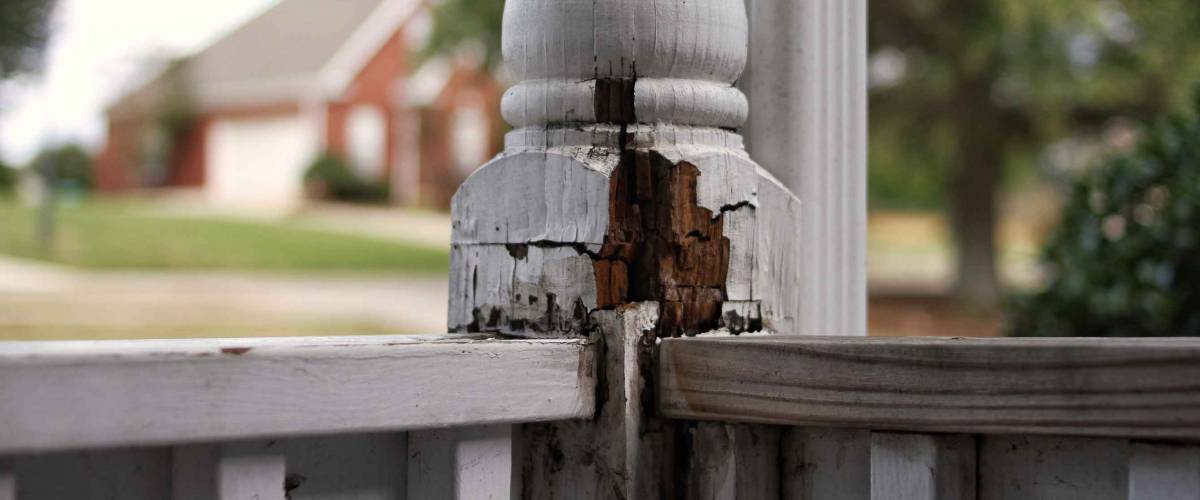 Deck post with rot and water damage.