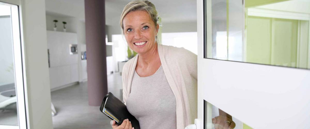 Real-estate agent presenting modern house