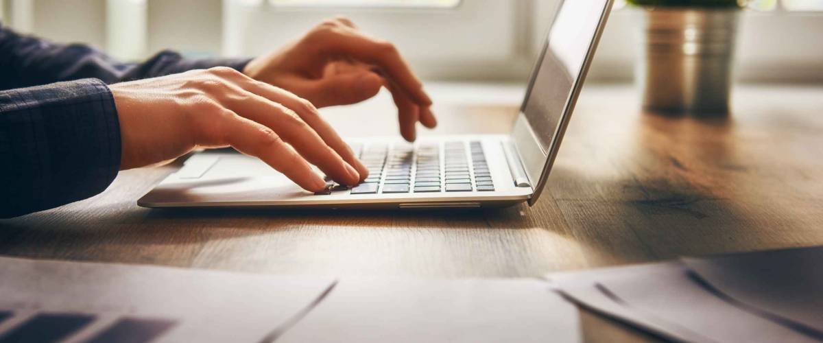 businessman using laptop computer sitting working office.