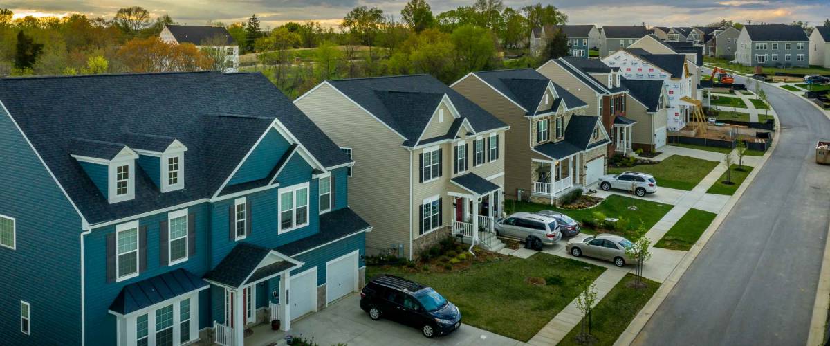 Aerial view of typical American new construction neighborhood street in Maryland for the upper middle class, single family homes USA real estate