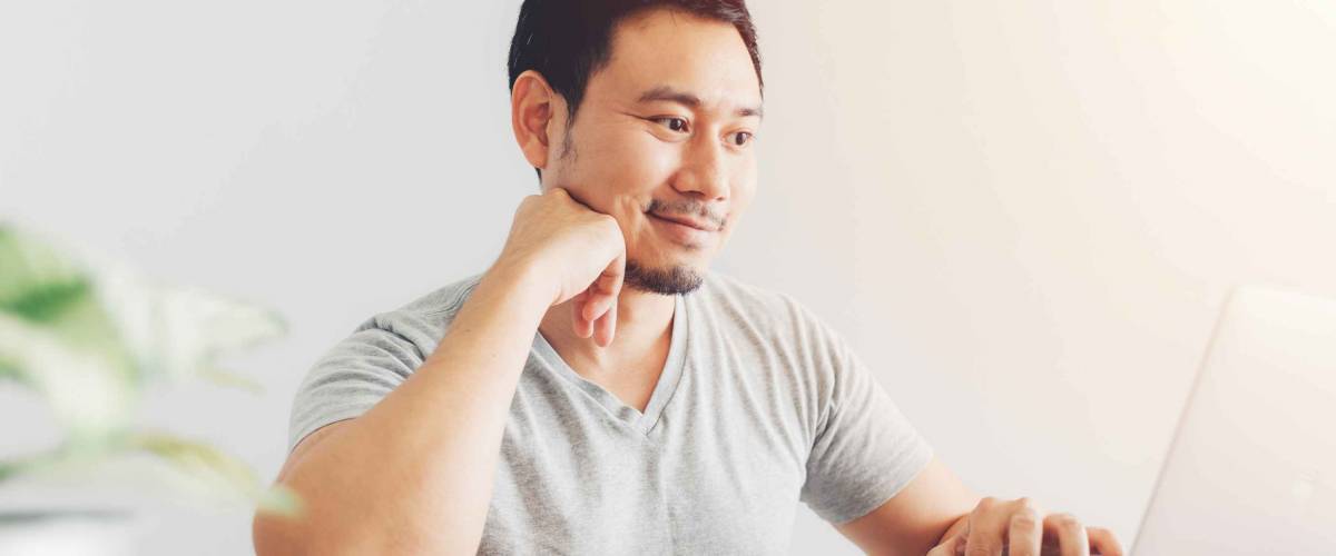 Happy Asian man has cleared the problems with billing and debts.