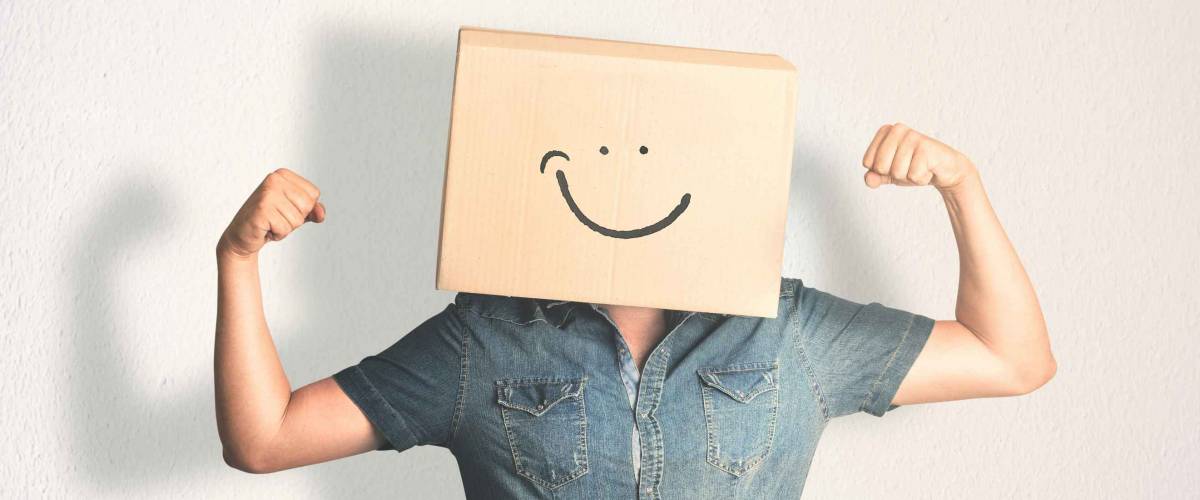 Man with smiling box over his head
