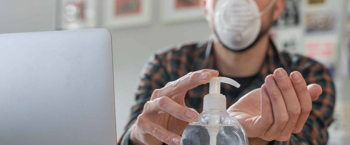 Man working from home wearing protective mask. quarantine for coronavirus wearing protective mask.