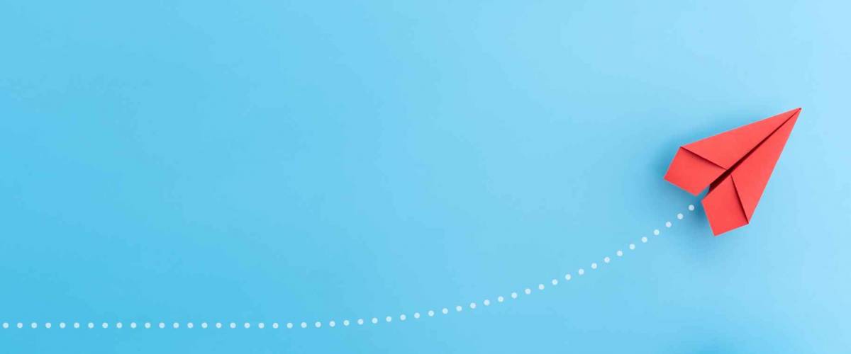 Group of paper plane in one direction and with one individual pointing in the different way. Business concept for new ideas creativity and innovative solution.