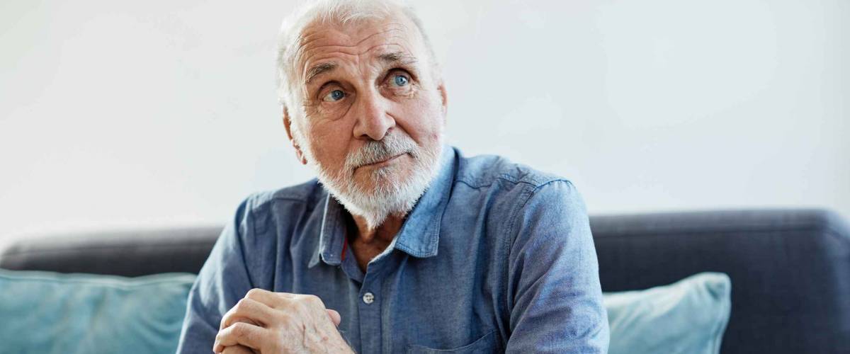 Portrait of a senior elderly man at home