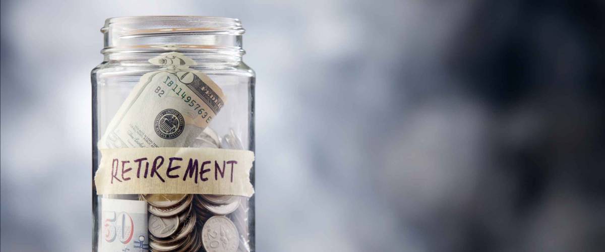 A jar of cash on the table.