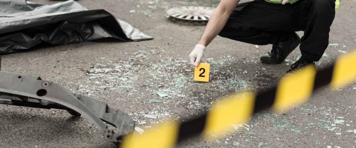 Policeman during investigation at road accident area