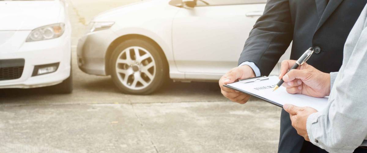 senior man and insurance agent claim process after car crash