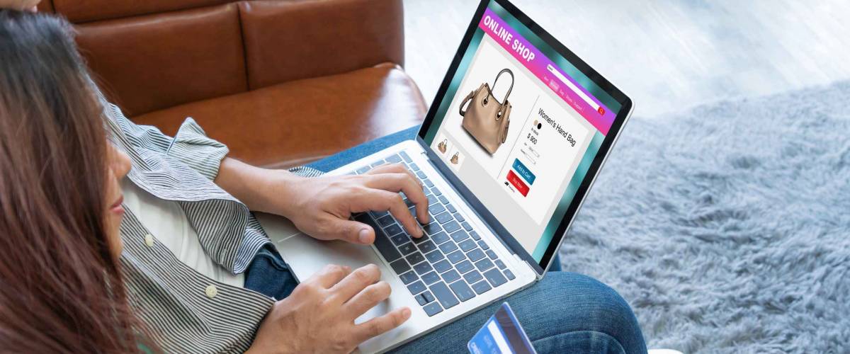Young couple use credit card for online shopping on internet website at home.