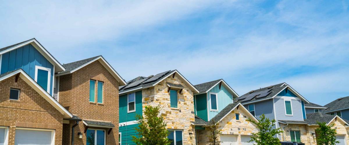 homes , houses , real estate mansions and luxury living row houses modern blue and grey brick homes in Austin , Texas , USA