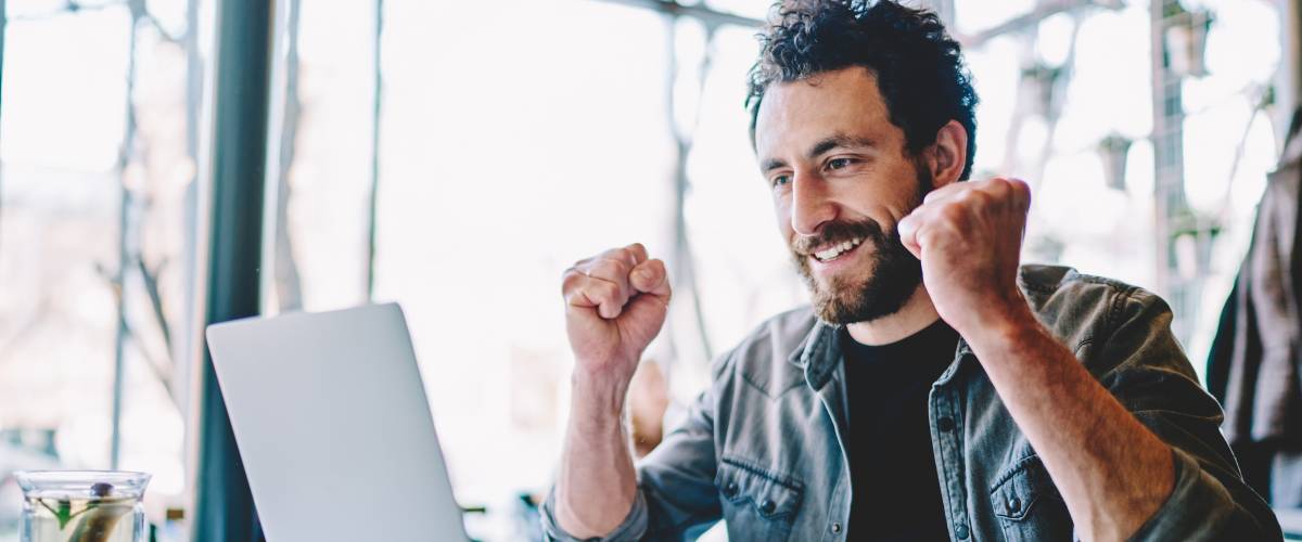 Happy guy checking his credit score