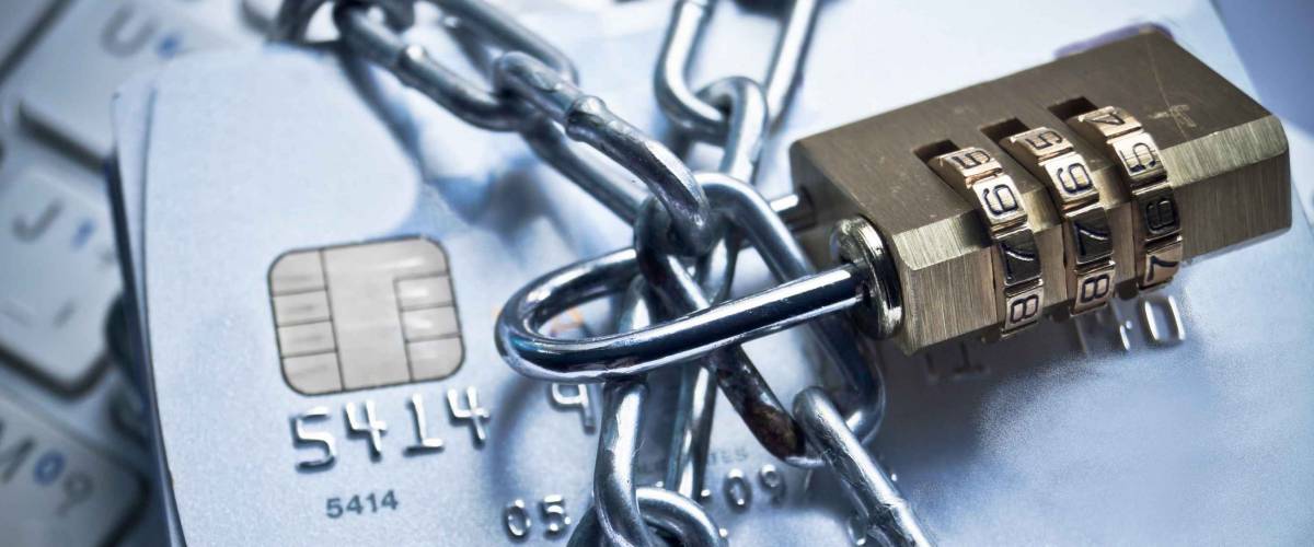 chained credit cards security lock on top of them