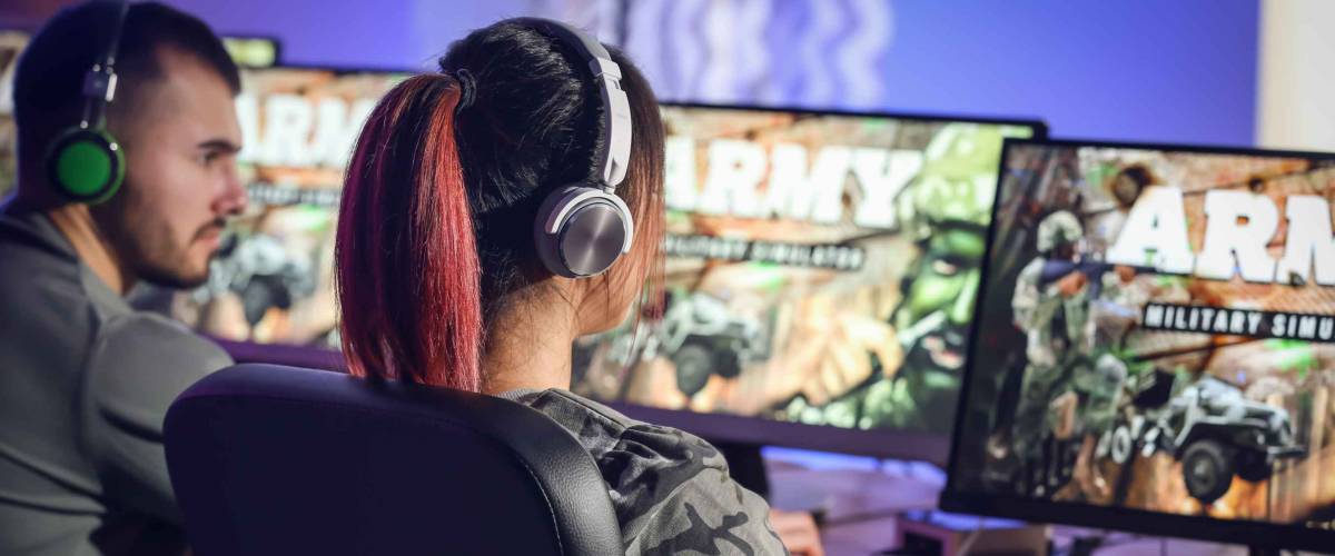 Young people playing video games at tournament
