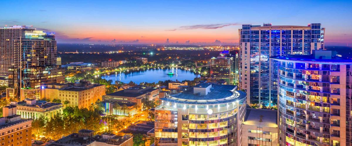 Orlando, Florida, USA aerial cityscape towards Eola Lake.