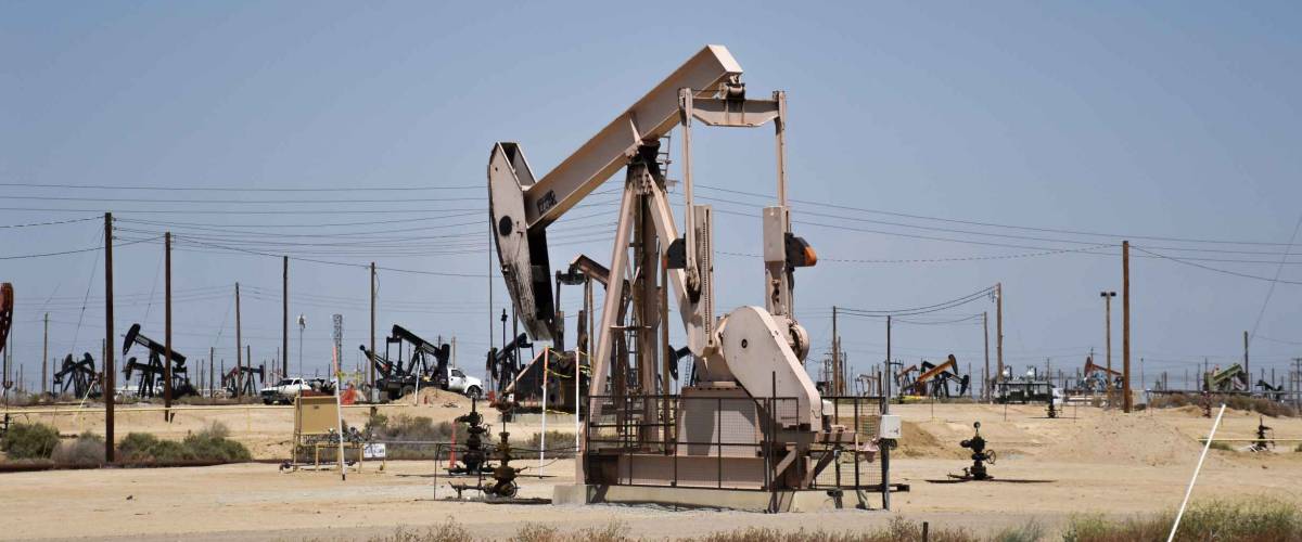 Industrial Oil Pump field in New Mexico during a soaring hot day