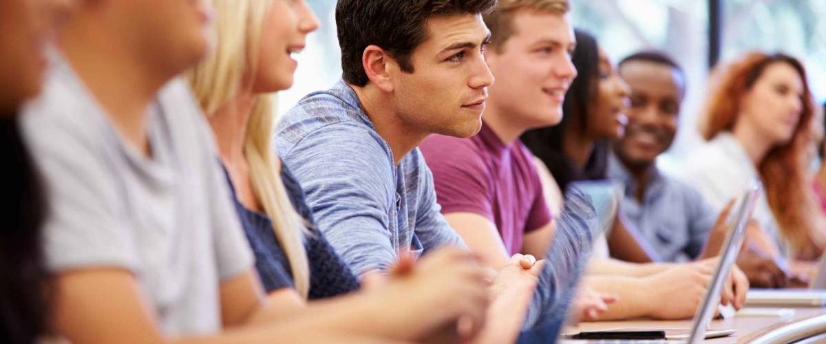 Class Of University Students Using Laptops In Lecture
