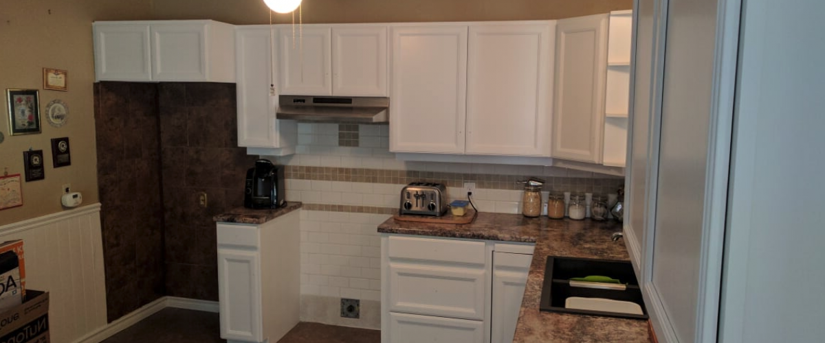 A dark and dingy kitchen prior to refurbishment.