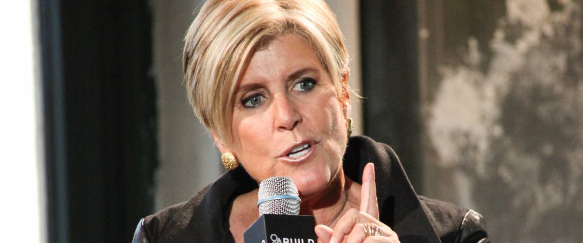 Suze Orman speaks at a Q&A in New York, pointing her finger