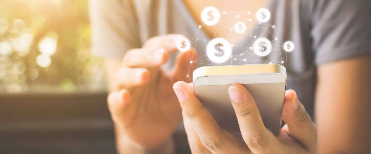 Woman hand using mobile phone with online transaction application.