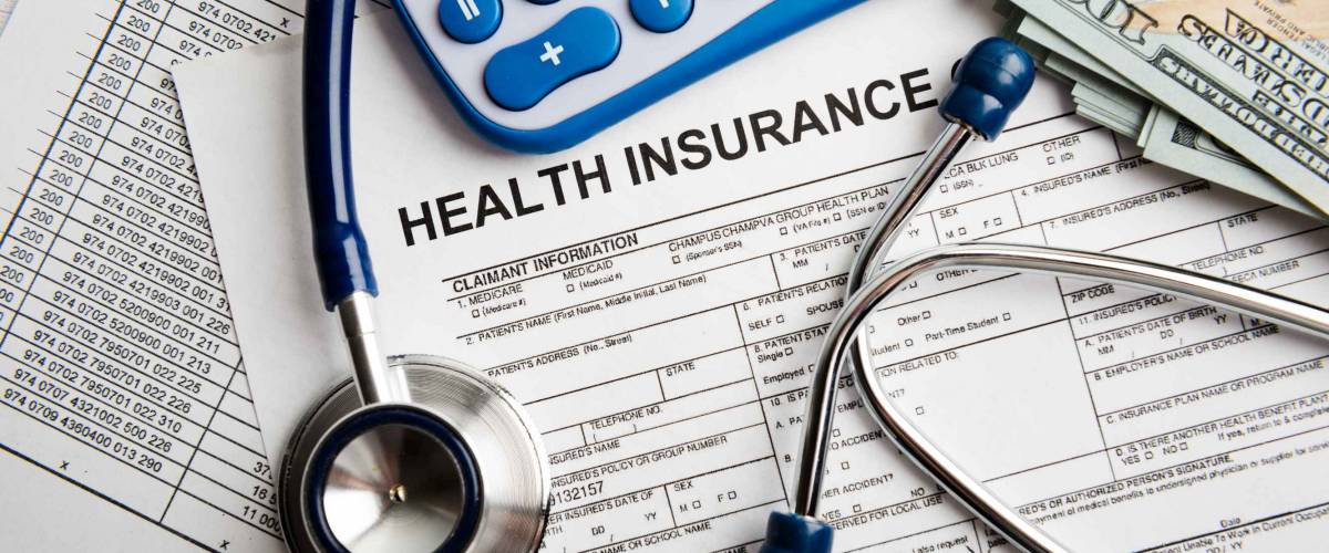 Health insurance application form with banknote and stethoscope concept for life planning