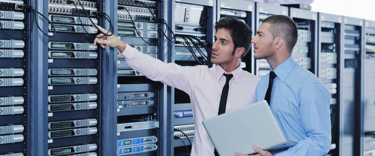 group of young business people it engineer in network server room solving problems and give help and support
