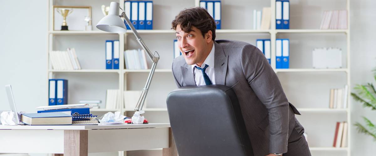 Businessman having fun taking a break in the office at work