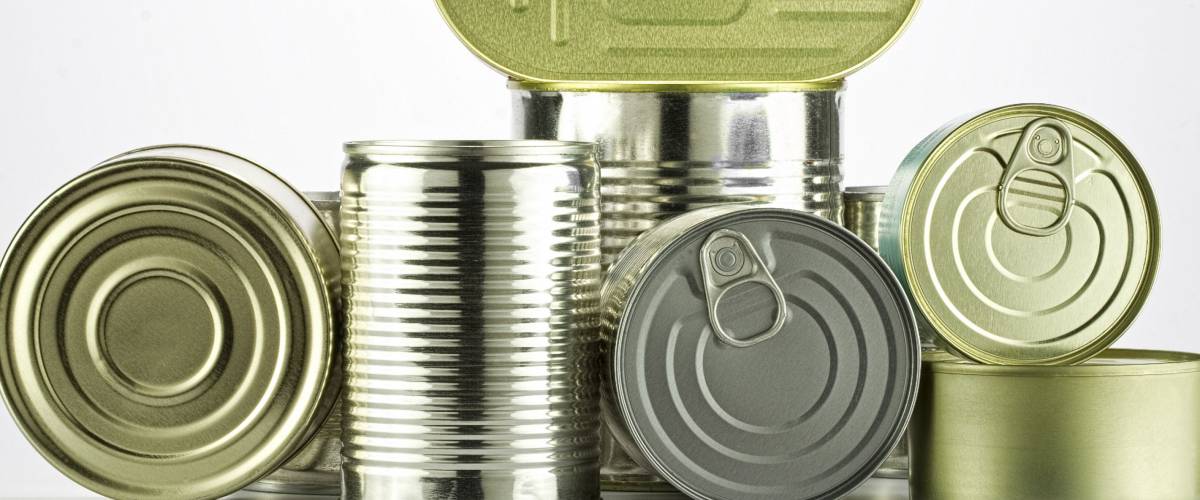 lots of cans against white background