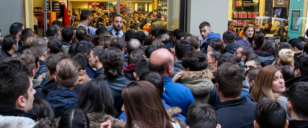 Thessaloniki, Greece - November 25, 2016. People wait outside a department store during Black Friday shopping deals, at the northern Greek city of Thessaloniki.