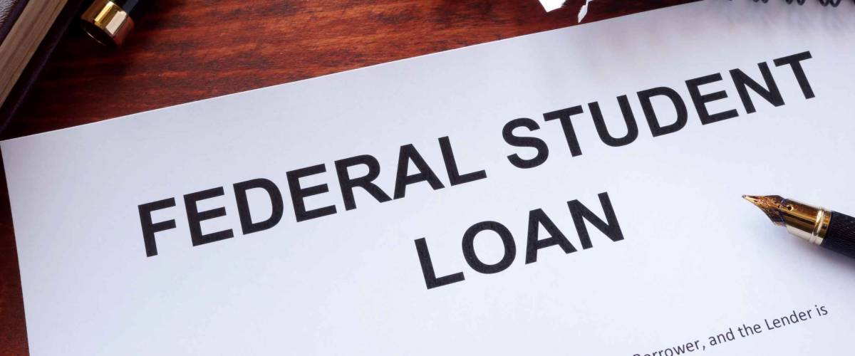 Federal student loan form on a table.