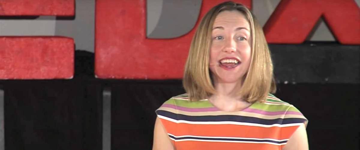 Elizabeth Dunn pictured at a Ted Talk, in the middle of saying something