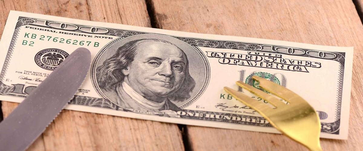 american money, dollars and knife