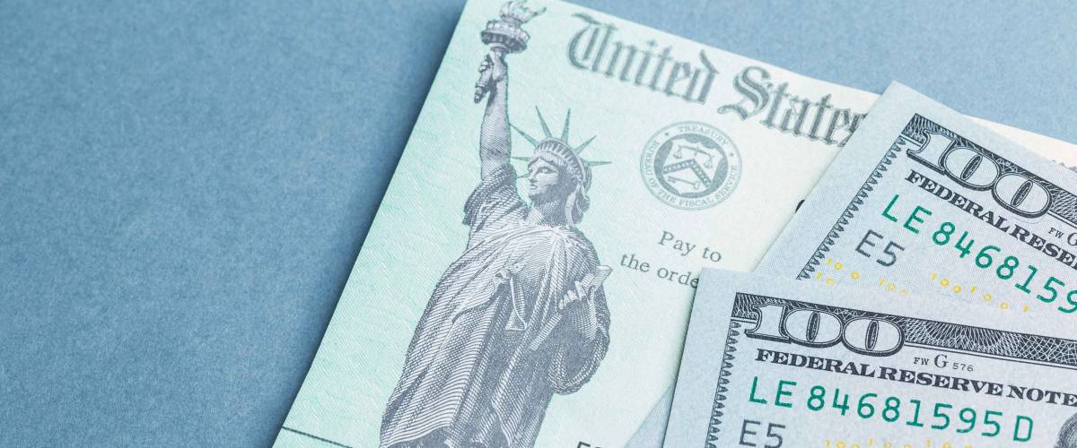 A US stimulus check with some one-hundred-dollar bills