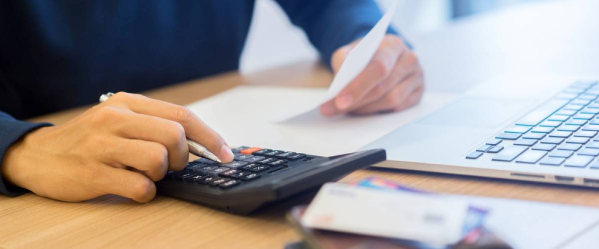 Man calculating payment