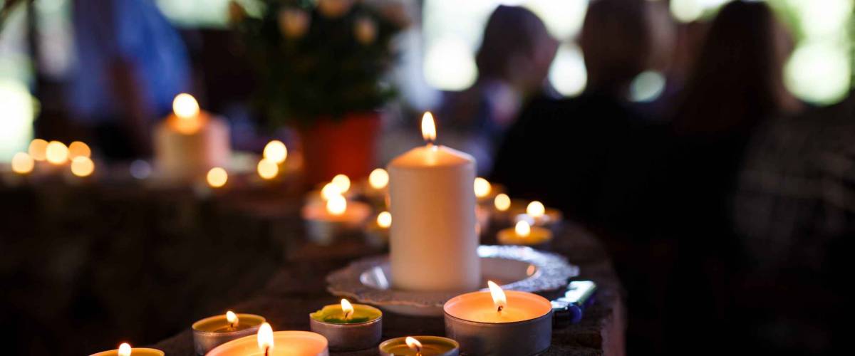 Flaming candles at the funeral ceremony indoor