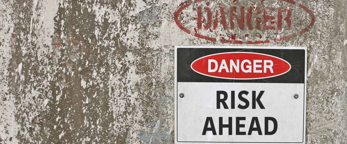 red, black and white Danger, Risk Ahead warning sign