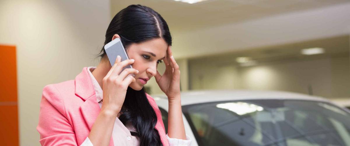 Stressed out woman at car dealership