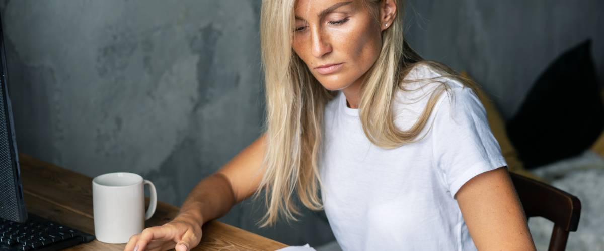 business woman at her desk does the bookkeeping, settles bills and controls the business