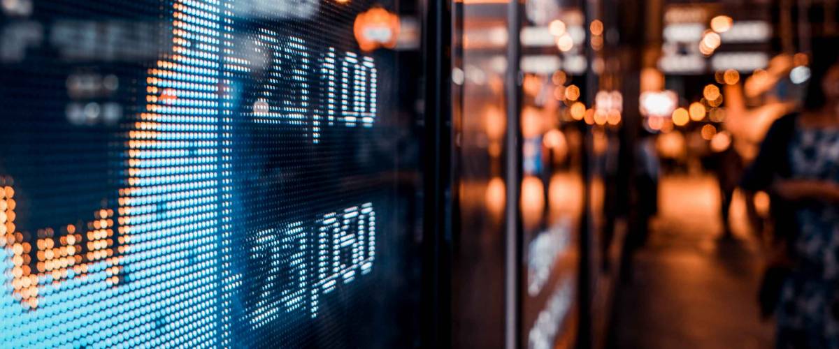 Financial stock exchange market display screen board on the street, selective focus