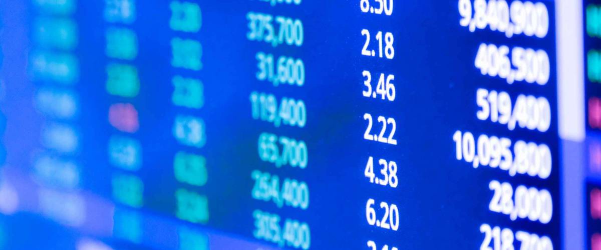Closeup Display of Stock market quotes with city scene reflect on glass of LED, stock market graph on the screen, Business, finance or investment background concept
