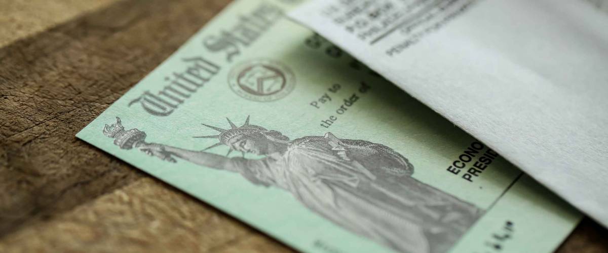 Extreme close-up of Federal coronavirus stimulus check provided to all Americans from the United States Treasury in 2020 and 2021, showing the statue of liberty.