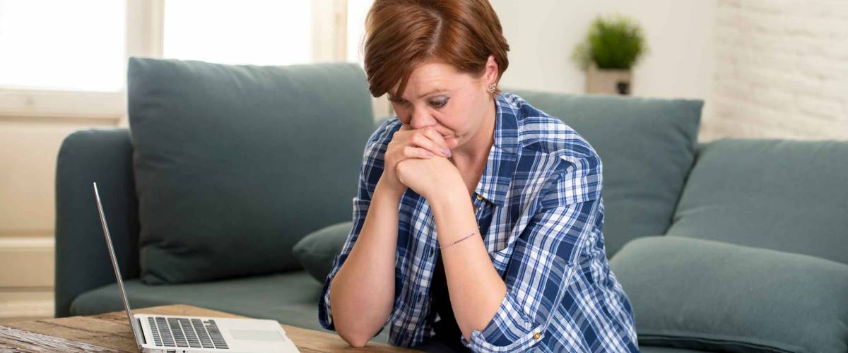 Woman worried about paying bills.