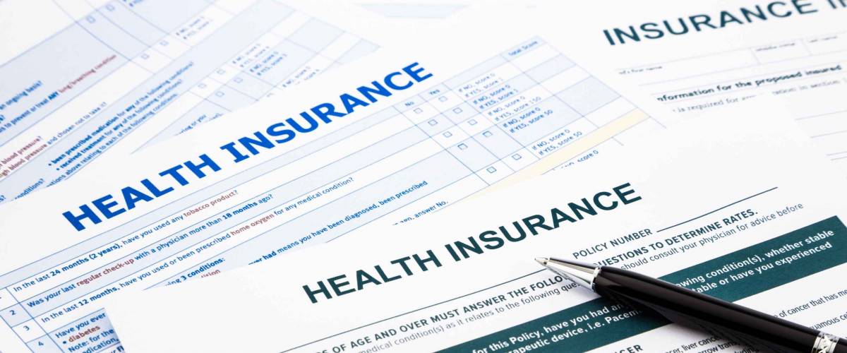 pile of health insurance claim forms