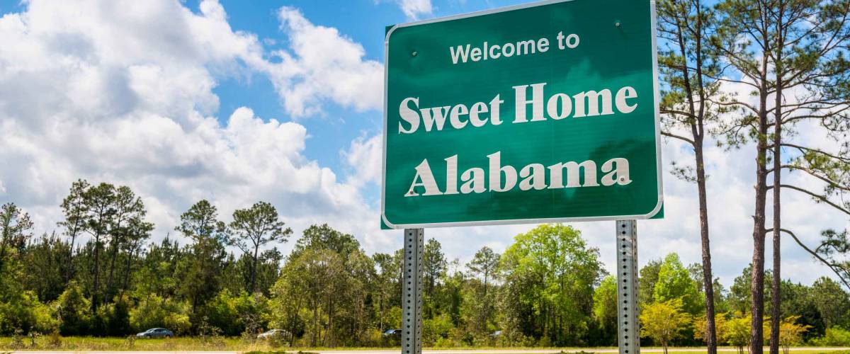 Welcome to Sweet Home Alabama Road Sign along Interstate 10 in Robertsdale, Alabama USA, near the State Border with Florida