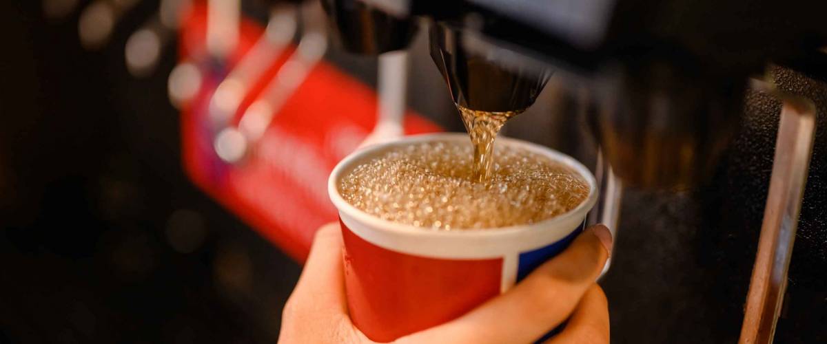 man pours a fizzy drink.sparkling water.cool ice soft drink cola