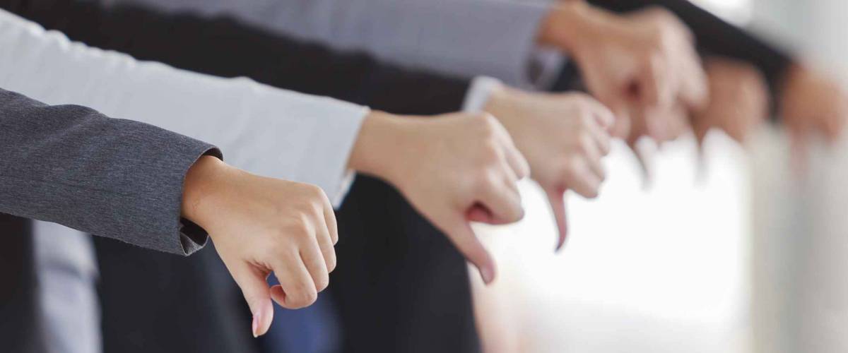 Large group of business people showing thumbs down.,Thinking sad businessman.,Dislike sign, thumb down.,fine portrait of team leader young businessman showing thumbs down,