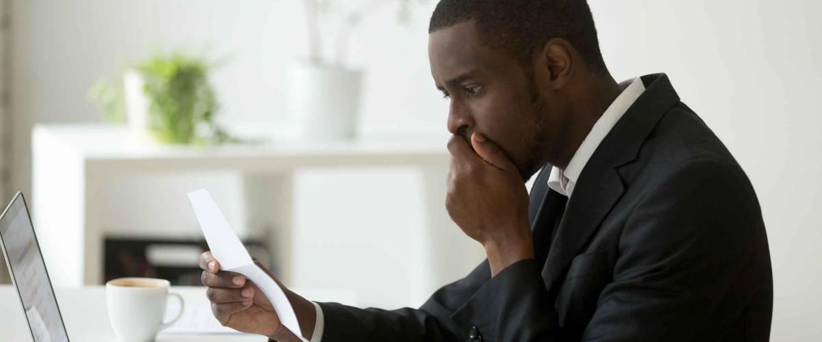 Shocked african-american businessman