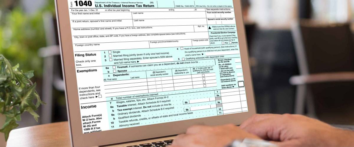 taxes payment concept. accountant are filling Individual income tax return forms online on screen laptop computer.